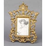 A Victorian pierced cast iron easel photograph frame, the back marked NO1009.P 30cm x 22cm
