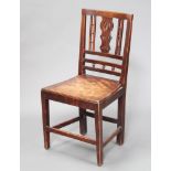 A Georgian mahogany slat back hall chair with solid seat, raised on turned supports The frame is