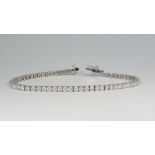 An 18ct white gold brilliant cut tennis bracelet, 5.18ct, 19cm, 11.6 grams