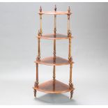 A Victorian inlaid and figured walnut 4 tier corner what-not, raised on reeded columns and