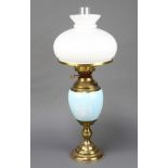 A 19th Century blue floral patterned porcelain and gilt metal mounted oil lamp, the burners marked