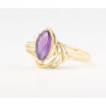 A lady's 14ct yellow gold amethyst and diamond scroll ring, 2.5 grams, size Q