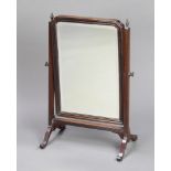 A 19th Century arched bevelled plate dressing table mirror in a mahogany swing frame 62cm h x 39cm w