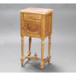 A 19th Century French bleached walnut bedside cabinet with pink veined marble top, fitted a drawer