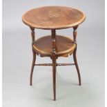 An Edwardian circular, crossbanded and inlaid mahogany 2 tier occasional table raised on turned