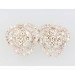 A pair of 18ct white gold diamond scroll ear studs, 1.5ct, 4.1 grams