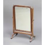 A 19th Century arched plate dressing table mirror contained in a mahogany swing frame 62cm x 39cm