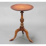 A circular Georgian style inlaid mahogany wine table raised on turned pillar and tripod base 56cm