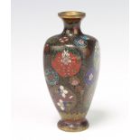 A Meiji period cloisonne rounded tapered vase decorated with flowers 12cm The vase is dented