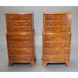 A pair of Queen Anne style figured walnut bow front chests on chests, the upper section fitted 3