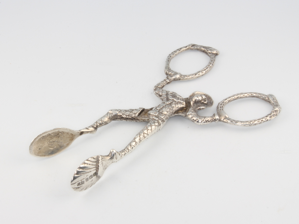 A pair of novelty silver figural sugar tongs in the form of an acrobat 10cm, 32 grams