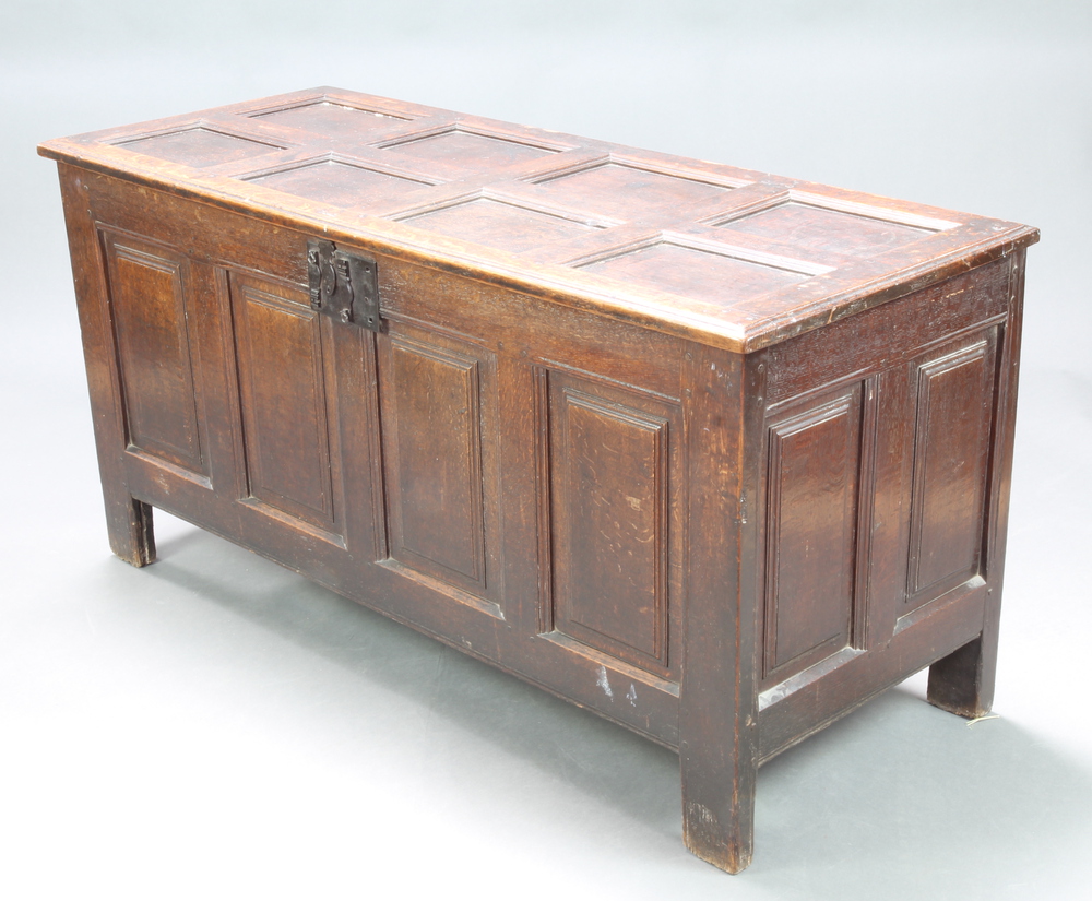 A 17th/18th Century oak coffer of panelled construction with hinged lid and iron lock (a/f) 69cm h x
