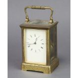 A 19th Century French 8 day carriage alarm clock with enamelled dial and Roman numerals contained in