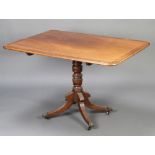 A Georgian rectangular, crossbanded mahogany snap top breakfast table, raised on a turned column and