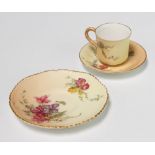 A Royal Worcester blush porcelain teacup and saucer decorated with flowers together with a ditto