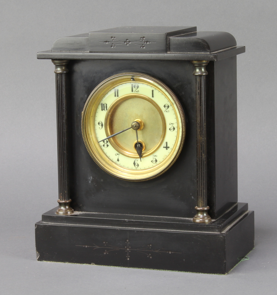 A 19th Century French timepiece with enamelled dial and Arabic numerals contained in a black