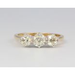 An 18ct yellow gold 3 stone diamond ring approx. 1.26ct, 3.8 grams, size O