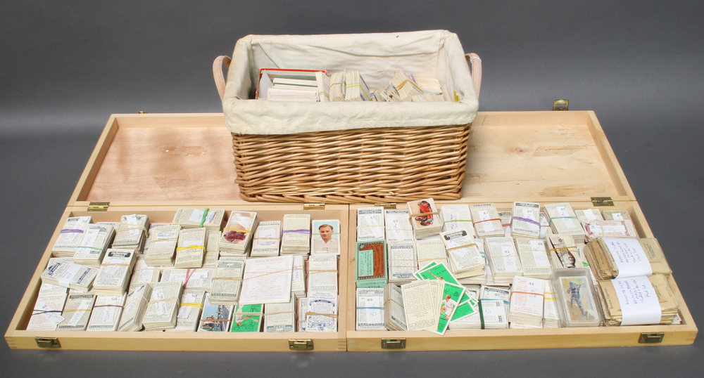 A collection of cigarette and tea cards contained in 2 shallow boxes and a rectangular twin