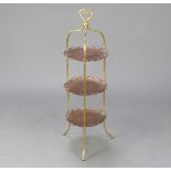 A Victorian copper and brass 3 tier cake stand raised on outswept supports 91cm h x 26cm w