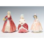 Three Royal Doulton figures - Peggy HN2030 13cm, Lily HN1798 14cm and Janet HN1537 16cm