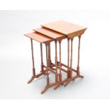 A nest of 3 Edwardian rectangular mahogany interfitting coffee tables raised on turned supports 60cm