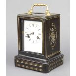 A Victorian 8 day striking carriage clock with enamelled dial and Roman numerals contained in an