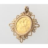 A 1908 half sovereign contained in a 3.5 gram 9ct pendant mount