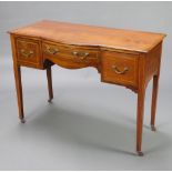 An Edwardian inlaid mahogany bow front side table fitted a frieze drawer flanked by 2 short