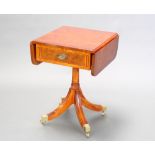A Georgian style crossbanded yew pedestal drop flap occasional table fitted a frieze drawer,