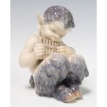 A Royal Copenhagen figure of Pan playing his pipes 15cm