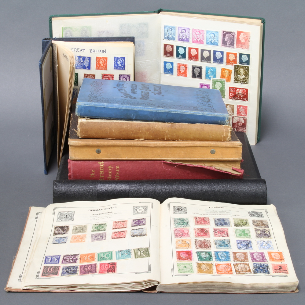 An album of GB mint stamps Edward VIII to Elizabeth II, a red Standard album of used world stamps