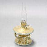 A Victorian circular brass oil lamp reservoir of waisted form raised on 4 stylised hoof supports