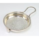 A George III silver lemon strainer with loop handle and now with side clip London 1783, 72 grams,