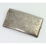 A George V silver card case with engraved scroll decoration Birmingham 1912 46 grams