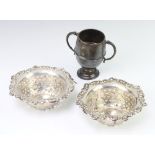 A pair of Edwardian circular silver pierced bon bon dishes Birmingham 1905 together with a 2 handled
