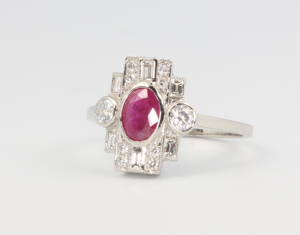 A platinum ruby and diamond cluster ring in the Edwardian style, the ruby approx. 0.65ct the