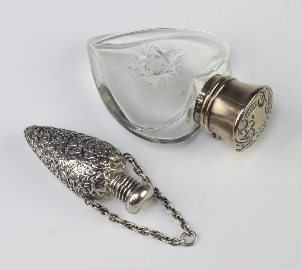 An Edwardian silver mounted heart shaped cut glass scent bottle Birmingham 1907 8cm together with