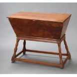 An 18th Century rectangular elm dough proving bin of typical form, raised on turned and block