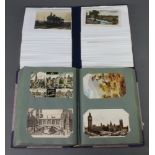 Two albums of black and white and coloured postcards