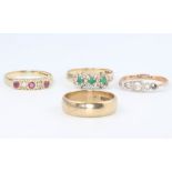 Three 9ct yellow gold gem set rings, size N, 5.8 grams and a 9ct yellow gold wedding band size O 3.8