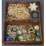 A carved vinous decorated jewellery box containing vintage and other costume jewellery