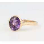 A 9ct yellow gold amethyst ring size O 1/2, 4.1 grams