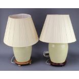 A pair of 20th Century Chinese crackle glazed table lamps of ovoid form 31cm x 20cm on hardwood