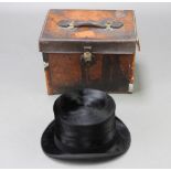 Lincoln Bennett, a gentleman's black silk top hat, size 7 1/4, contained in a brown leather carrying