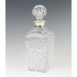A cut glass tapered decanter with silver collar London 1969, 27cm