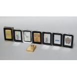 Eight Zippo lighters - four Harley Davidson Motorcycles, Ford, two Benetton Formula One, all boxed