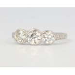 A platinum 3 stone diamond ring with diamond shoulders approx. 1.2ct, size P, 3.8 grams