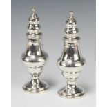 A pair of George III silver vase shaped peppers London 1801, 196 grams, 16cm