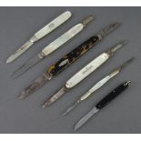 A silver bladed folding cake knife with mother of pearl grip, 2 double bladed folding pen knives