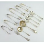 An Edwardian silver lily pattern sifter spoon and a quantity of lily pattern forks and tongs etc,